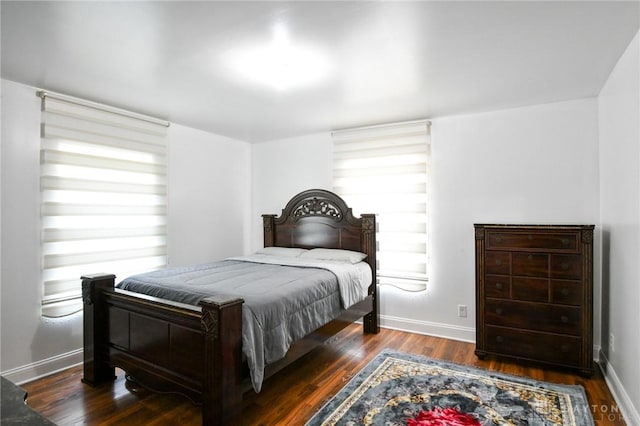 719 N Keowee St, Dayton, OH 45404 - bedroom with wood finished floors and multiple windows