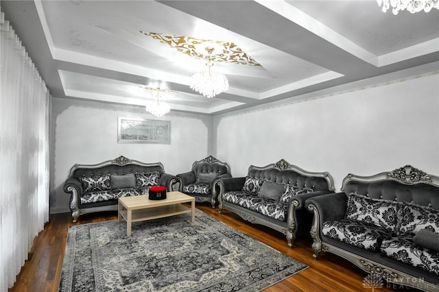 719 N Keowee St, Dayton, OH 45404 - living room featuring a chandelier, a raised ceiling, and wood finished floors