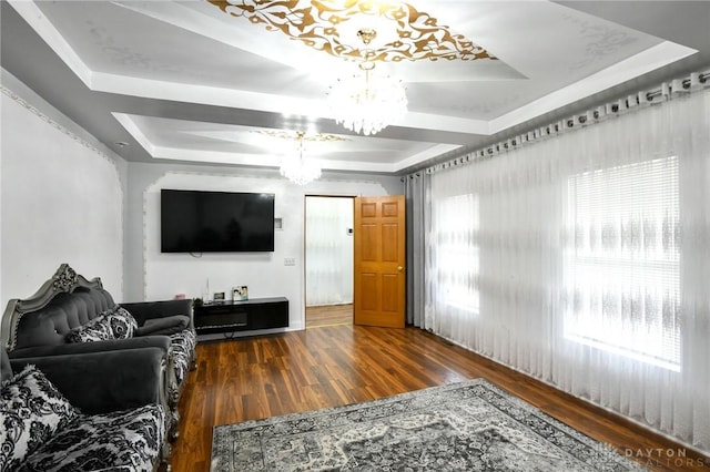 719 N Keowee St, Dayton, OH 45404 - living room featuring a chandelier, a raised ceiling, and wood finished floors