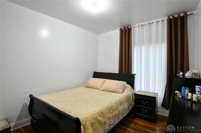 719 N Keowee St, Dayton, OH 45404 - bedroom featuring baseboards and dark wood-type flooring