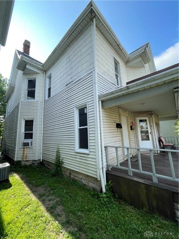 419 Baltimore St, Middletown, OH 45044 - view of side of property featuring a chimney, covered porch, and cooling unit