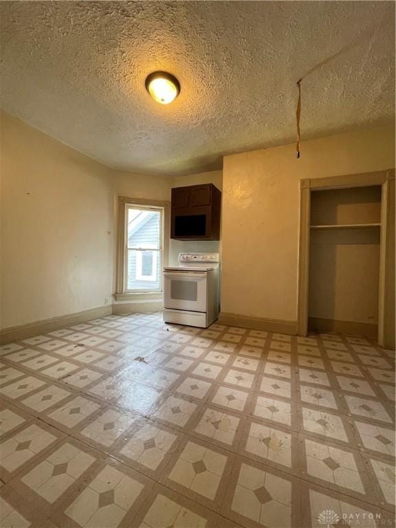 419 Baltimore St, Middletown, OH 45044 - kitchen with electric range and a textured ceiling