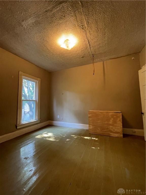 419 Baltimore St, Middletown, OH 45044 - unfurnished room with hardwood / wood-style floors and a textured ceiling