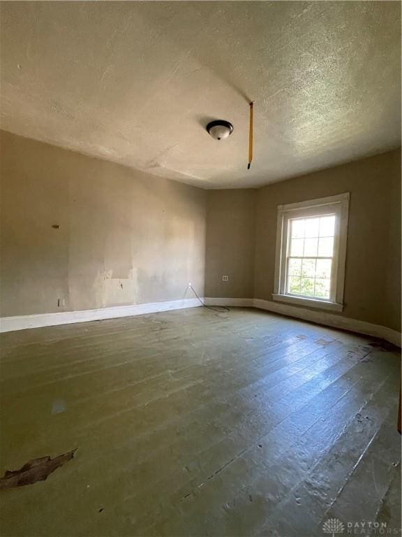 419 Baltimore St, Middletown, OH 45044 - spare room featuring baseboards and a textured ceiling