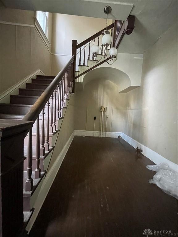 419 Baltimore St, Middletown, OH 45044 - stairway with a chandelier and wood finished floors