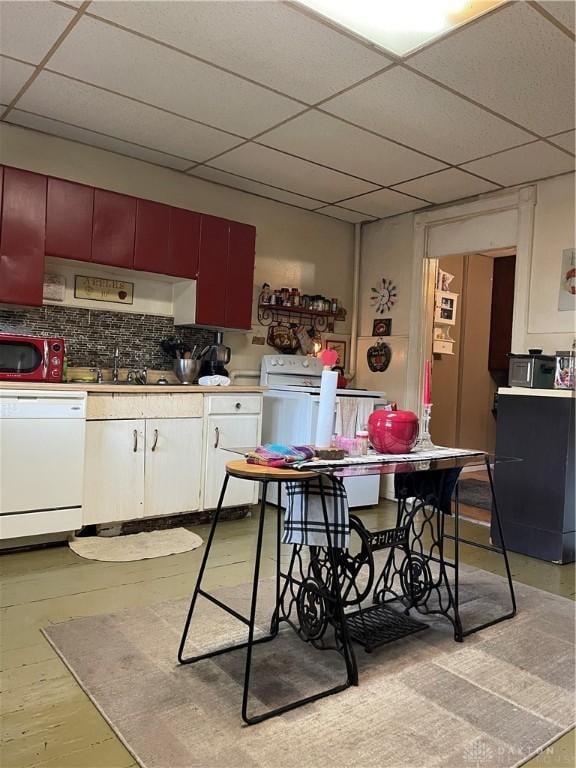 419 Baltimore St, Middletown, OH 45044 - kitchen featuring dishwasher, a drop ceiling, and tasteful backsplash