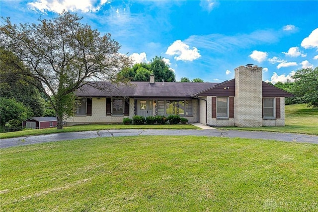 5282 Rahway Ct, Clayton, OH 45415 - ranch-style home with a chimney, brick siding, and a front yard