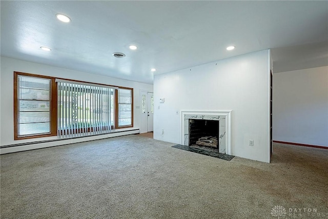 5282 Rahway Ct, Clayton, OH 45415 - unfurnished living room with a baseboard radiator, carpet flooring, a high end fireplace, and recessed lighting