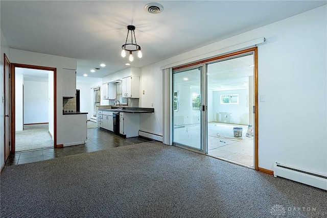 5282 Rahway Ct, Clayton, OH 45415 - kitchen with dark countertops, white cabinetry, dishwasher, baseboard heating, and recessed lighting