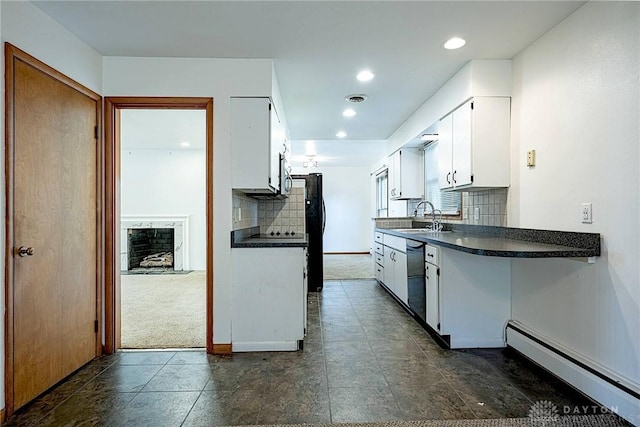 5282 Rahway Ct, Clayton, OH 45415 - kitchen featuring a baseboard radiator, freestanding refrigerator, dishwasher, dark countertops, and white cabinetry