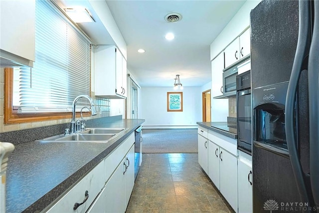 5282 Rahway Ct, Clayton, OH 45415 - kitchen featuring appliances with stainless steel finishes, dark countertops, white cabinetry, recessed lighting, and healthy amount of natural light