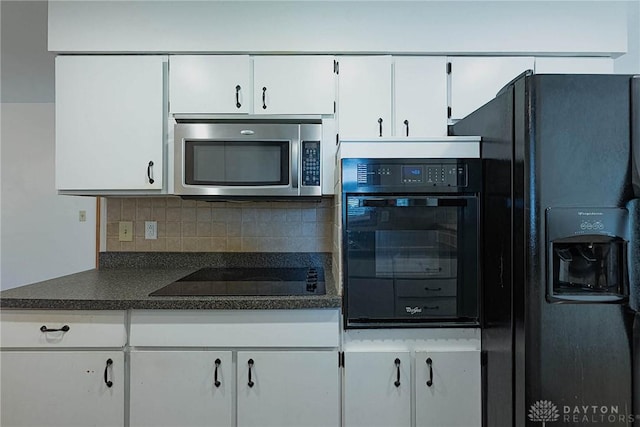 5282 Rahway Ct, Clayton, OH 45415 - kitchen featuring black appliances, dark countertops, white cabinets, and backsplash