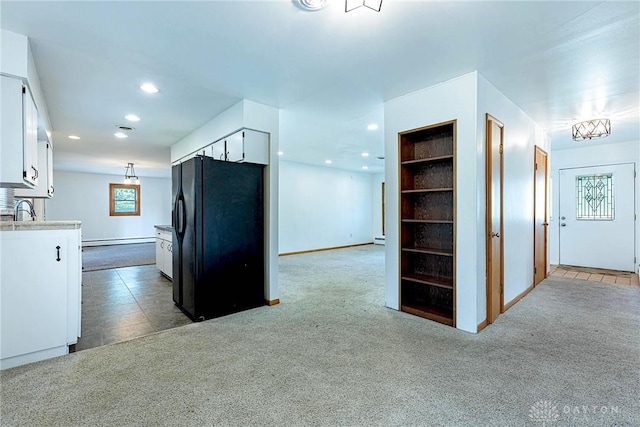 5282 Rahway Ct, Clayton, OH 45415 - kitchen with freestanding refrigerator, white cabinets, light carpet, recessed lighting, and light countertops