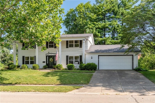 1269 Redbud Dr, Fairborn, OH 45324 - neoclassical / greek revival house featuring driveway, a front yard, and a garage