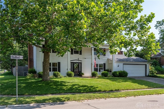 1269 Redbud Dr, Fairborn, OH 45324 - view of front facade with driveway, a garage, and a chimney