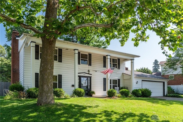1269 Redbud Dr, Fairborn, OH 45324 - view of front of property featuring a garage, driveway, and a chimney