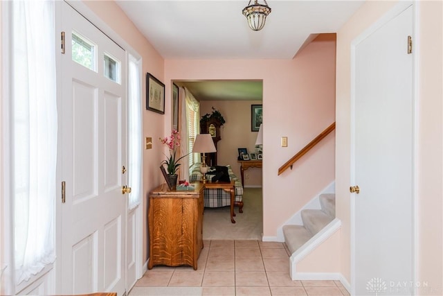 1269 Redbud Dr, Fairborn, OH 45324 - foyer entrance with light tile patterned flooring, stairway, and light carpet