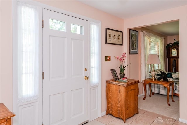 1269 Redbud Dr, Fairborn, OH 45324 - foyer featuring light tile patterned flooring and light carpet