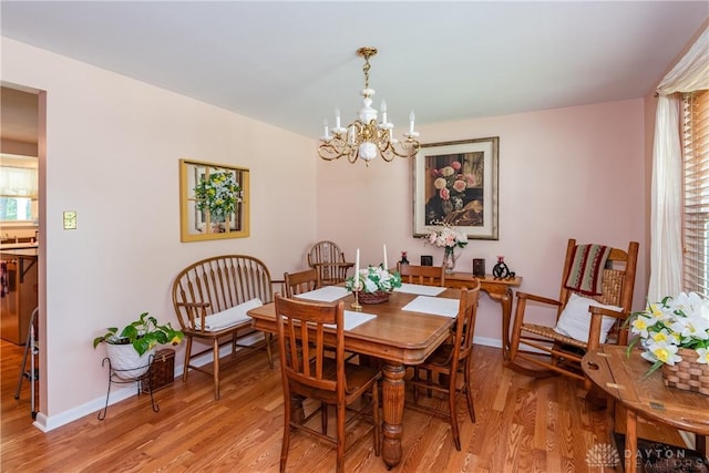 1269 Redbud Dr, Fairborn, OH 45324 - dining area with a chandelier and light wood finished floors