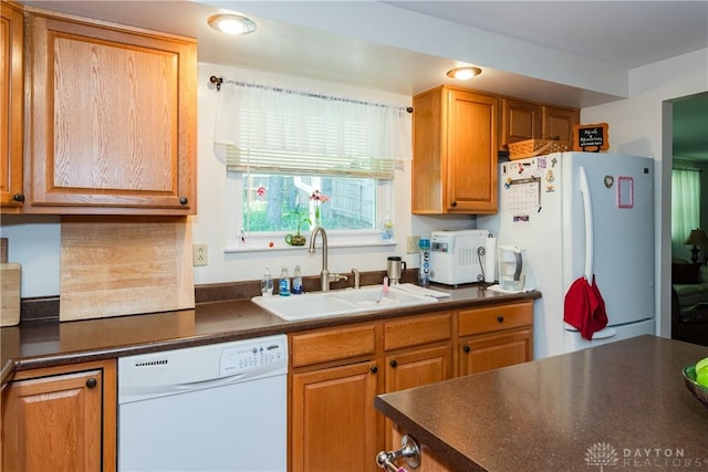 1269 Redbud Dr, Fairborn, OH 45324 - kitchen with white appliances, dark countertops, and brown cabinets