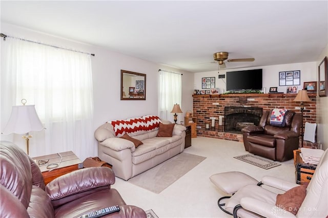 1269 Redbud Dr, Fairborn, OH 45324 - carpeted living area featuring a ceiling fan and a fireplace