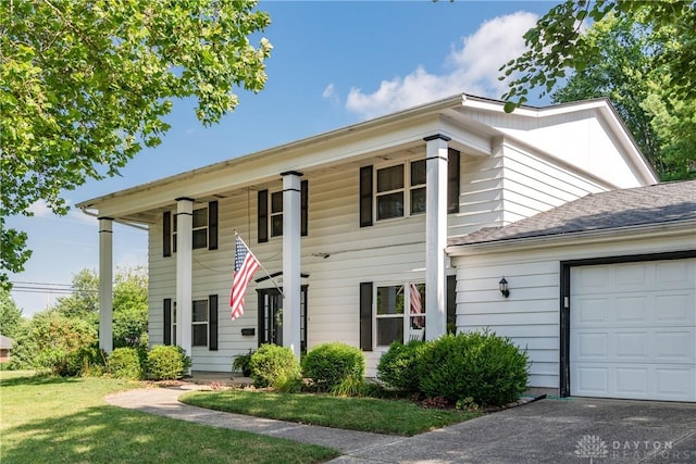 1269 Redbud Dr, Fairborn, OH 45324 - neoclassical home featuring an attached garage and a front yard