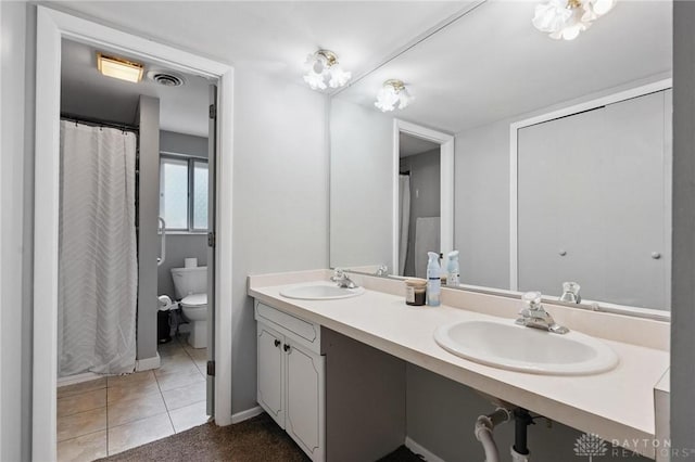 5433 Pentland Cir, Huber Heights, OH 45424 - bathroom featuring double vanity, tile patterned flooring, and a shower with shower curtain
