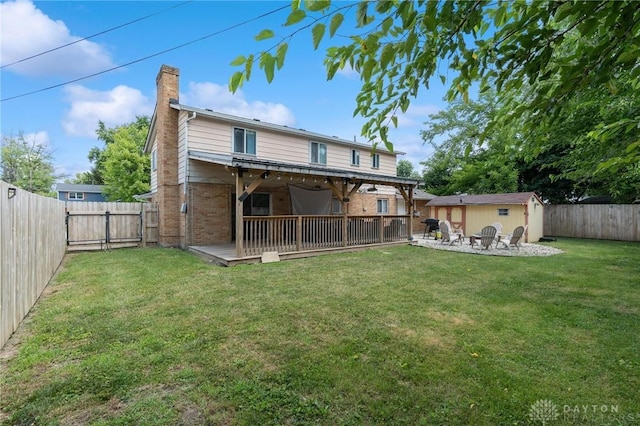 5433 Pentland Cir, Huber Heights, OH 45424 - rear view of property featuring a fenced backyard, a chimney, a shed, and brick siding