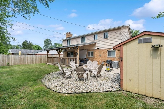 5433 Pentland Cir, Huber Heights, OH 45424 - rear view of house with a patio area, a chimney, brick siding, and an outbuilding