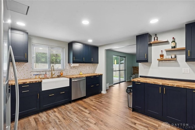 5433 Pentland Cir, Huber Heights, OH 45424 - kitchen featuring butcher block countertops, stainless steel appliances, open shelves, decorative backsplash, and light wood finished floors