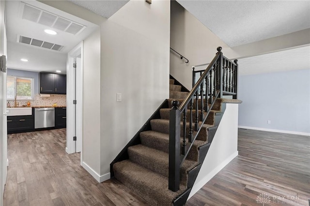 5433 Pentland Cir, Huber Heights, OH 45424 - stairway featuring wood finished floors and baseboards