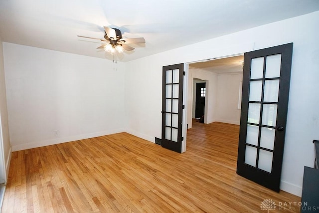 1151 Brookview Ave, Dayton, OH 45409 - unfurnished room featuring french doors, light wood finished floors, and ceiling fan