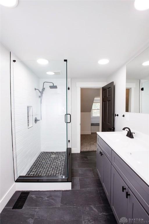 1151 Brookview Ave, Dayton, OH 45409 - bathroom with a stall shower and double vanity