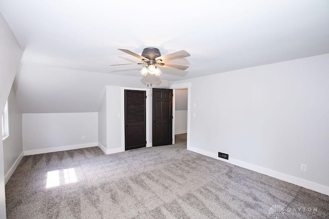 1151 Brookview Ave, Dayton, OH 45409 - unfurnished bedroom featuring carpet flooring, ceiling fan, a closet, and lofted ceiling