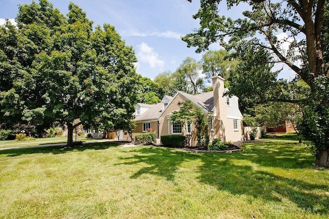 1151 Brookview Ave, Dayton, OH 45409 - view of front facade with a front yard and a chimney