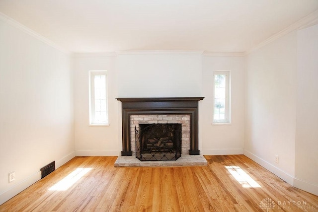 1151 Brookview Ave, Dayton, OH 45409 - unfurnished living room featuring wood finished floors, ornamental molding, and a fireplace