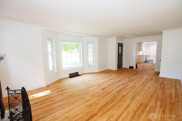 1151 Brookview Ave, Dayton, OH 45409 - unfurnished living room with light wood finished floors and ornamental molding