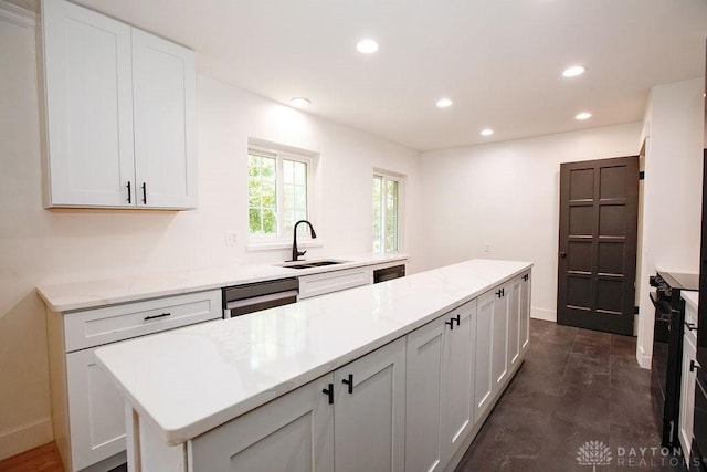 1151 Brookview Ave, Dayton, OH 45409 - kitchen featuring white cabinets, recessed lighting, light stone counters, and dishwasher