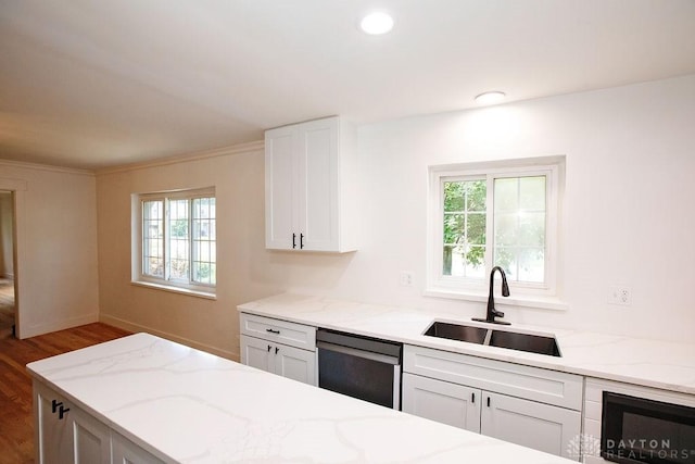 1151 Brookview Ave, Dayton, OH 45409 - kitchen featuring dishwasher, wood finished floors, light stone counters, white cabinetry, and ornamental molding