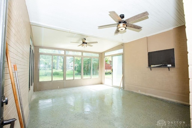 1151 Brookview Ave, Dayton, OH 45409 - unfurnished sunroom with speckled floor, lofted ceiling, and brick wall