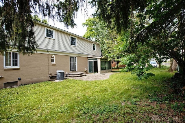 1151 Brookview Ave, Dayton, OH 45409 - rear view of property featuring a yard and a sunroom