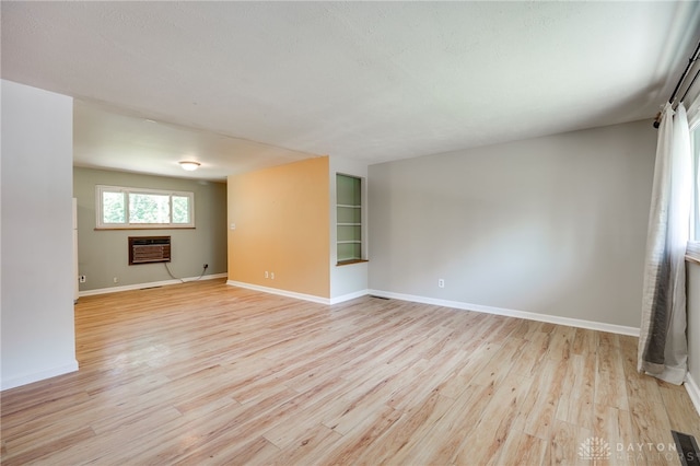 57 Pollyanna Ave, Germantown, OH 45327 - unfurnished room with light wood-style floors and heating unit