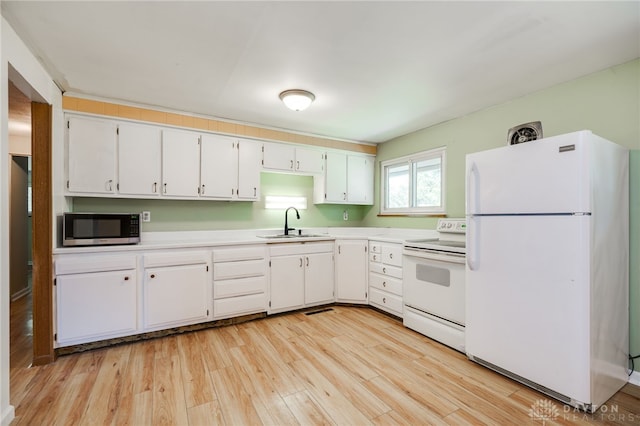 57 Pollyanna Ave, Germantown, OH 45327 - kitchen featuring white appliances, light countertops, light wood finished floors, and white cabinetry