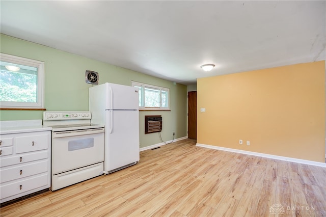57 Pollyanna Ave, Germantown, OH 45327 - kitchen with white appliances, light wood finished floors, white cabinetry, light countertops, and heating unit