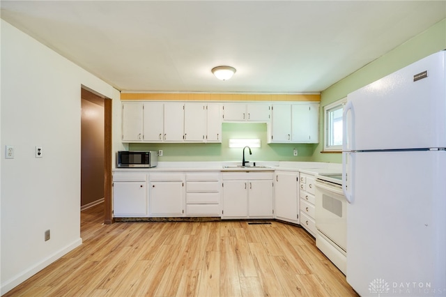 57 Pollyanna Ave, Germantown, OH 45327 - kitchen featuring white appliances, light wood-style floors, and light countertops