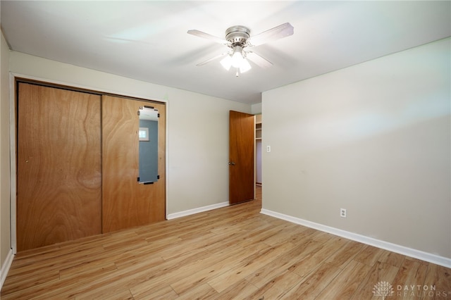 57 Pollyanna Ave, Germantown, OH 45327 - unfurnished bedroom with light wood-style flooring, a closet, and a ceiling fan
