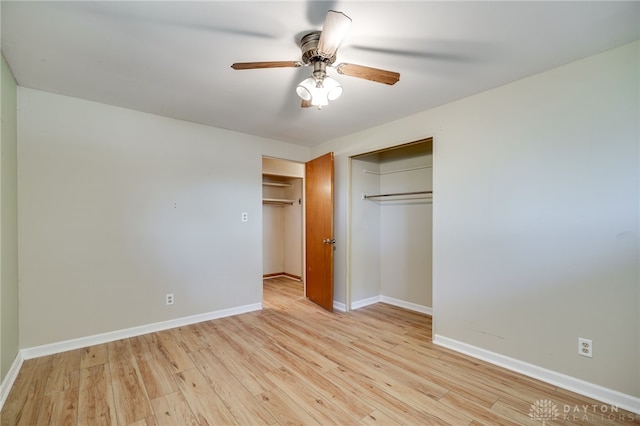 57 Pollyanna Ave, Germantown, OH 45327 - unfurnished bedroom with light wood-style floors, a ceiling fan, and a closet