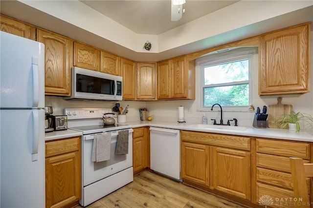 338 Chatham Dr, Fairborn, OH 45324 - kitchen with white appliances, light wood-type flooring, light countertops, and a ceiling fan