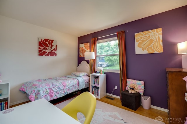 338 Chatham Dr, Fairborn, OH 45324 - bedroom featuring wood finished floors and baseboards