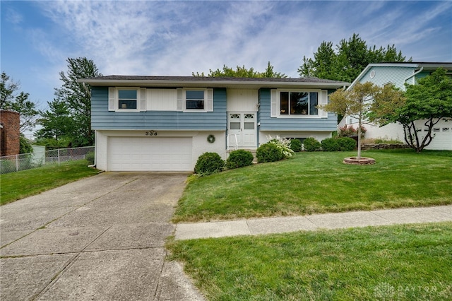 338 Chatham Dr, Fairborn, OH 45324 - raised ranch featuring driveway and an attached garage